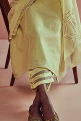 A women wearing yellow pure fancy chanderi suit set, ethnic wear for women.